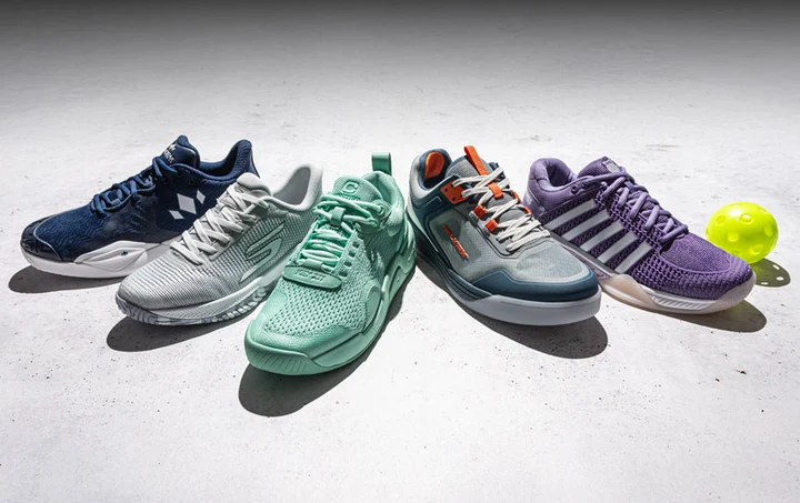 Two pairs of Babolat SFX 4 Pickleball shoes and a pickleball posed against a dark background