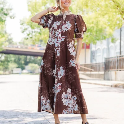 Brown is the color of the season. 🤎✨ Shop beautiful dresses in fall’s favorite shade, filled with standout prints, text