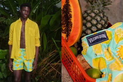 A man wearing swim shorts and shirt in a jungle landscape