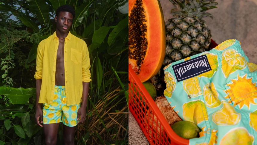 A man wearing swim shorts and shirt in a jungle landscape